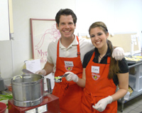Couple cooking together in cooking class.