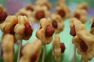 Garden Franks Presented on a Field of Wheat Grass by Suffolk County Caterers - Elegant Eating