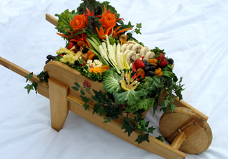 Wheel Barrel Display with Hye Rollers, Vegetables and Cheeses by Suffolk County Caterers Elegant Eating